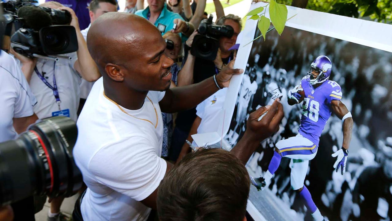 Adrian Peterson 'definitely happy' to be back with Vikings